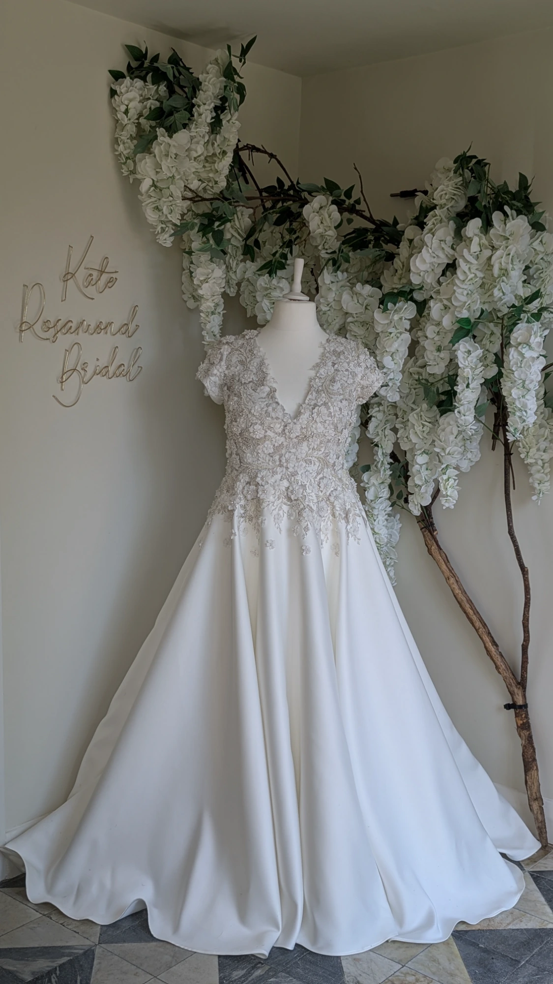 Entrance hall displaying custom wedding dresses from the Kate Rosamond Bridal Collection