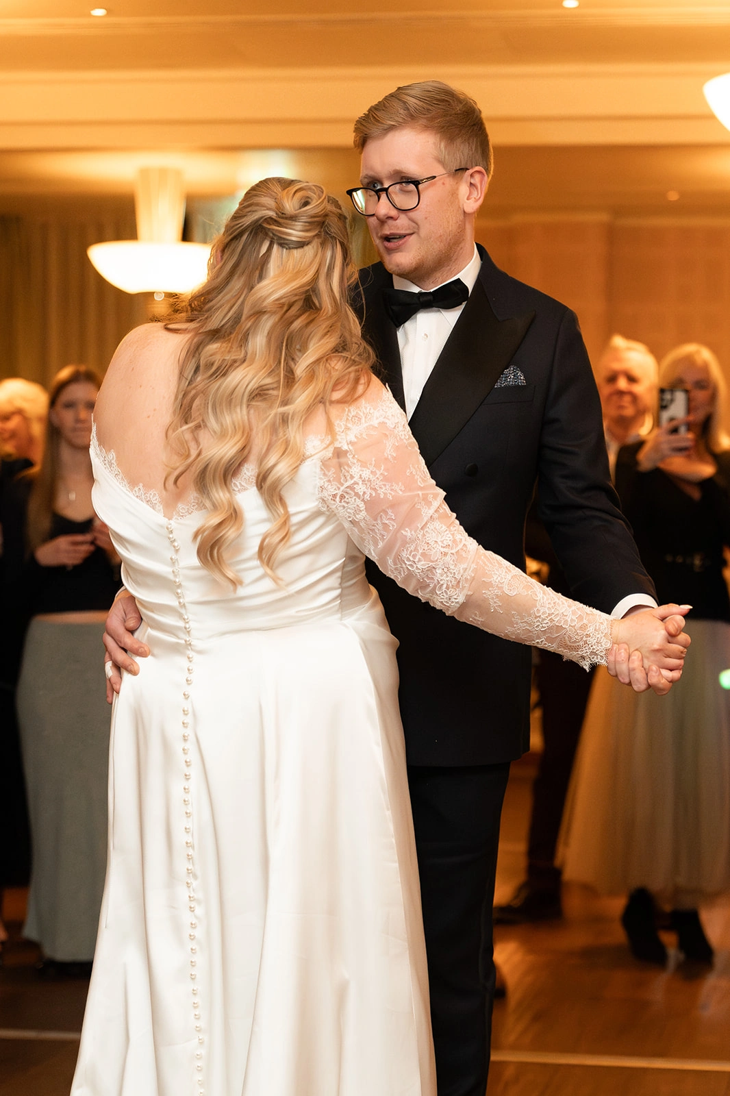 Custom wedding dress with covered buttons down the back, first dance at the reception